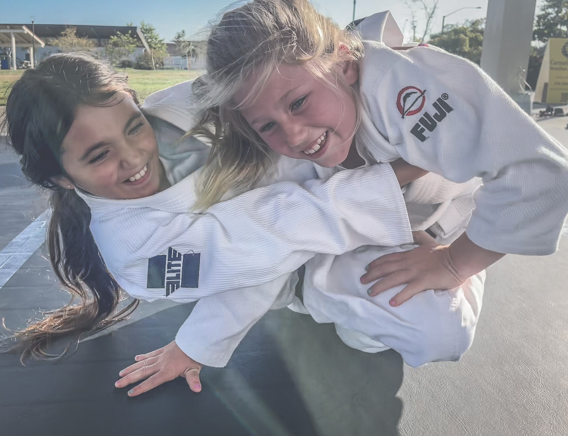Kids training jiu jitsu at the park